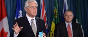 Frank Clegg, of Canadians For Safe Technology (Former President of Microsoft Canada,) looks on from right as Conservative MP Terence Young calls for tougher warnings on cell phones during a press conference on Parliament Hill in Ottawa on Monday, January 19, 2015. Terence announced multi-party support for his private member
